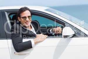Happy businessman in the drivers seat