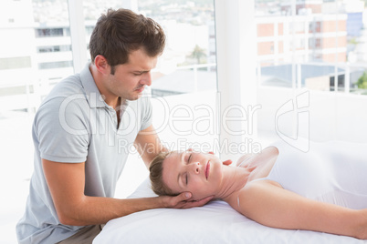 Woman receiving neck massage