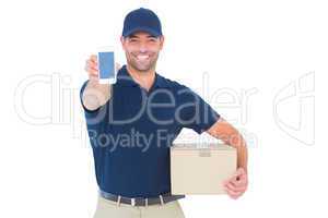 Handsome delivery man showing mobile phone