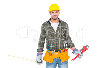 Manual worker holding various tools