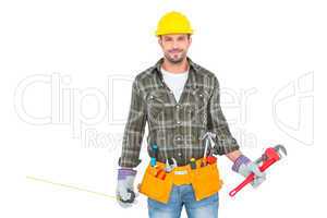 Manual worker holding various tools
