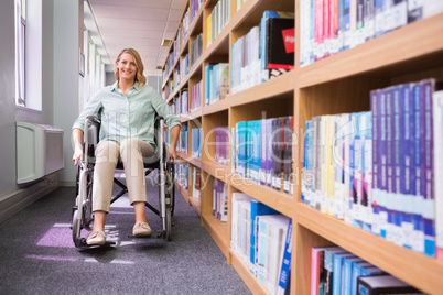 Smiling disabled student in library