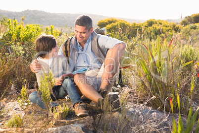 Father and son hiking in the mountains