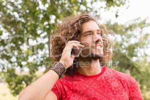 Happy young man using smartphone