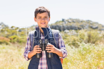 Little boy hiking in the mountains