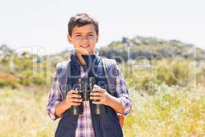 Little boy hiking in the mountains