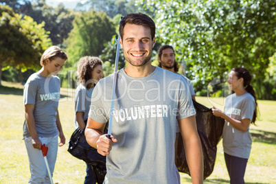 Team of volunteers picking up trash