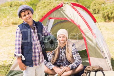 Father and son in their tent