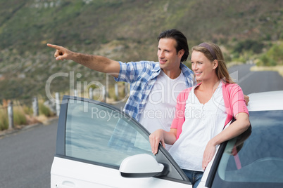 smiling couple looking away