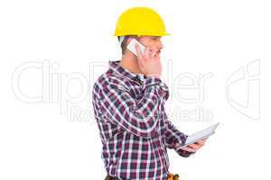 Repairman on the phone holding tablet pc