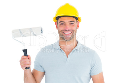 Portrait of manual worker holding paint roller