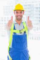 Worker wearing safety harness while gesturing thumbs up