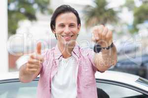 Man smiling and showing thumbs up