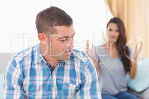 Man looking at woman fighting with him