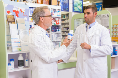 Concentrated pharmacist speaking about medication