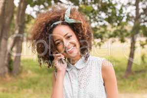 Happy young woman using smartphone