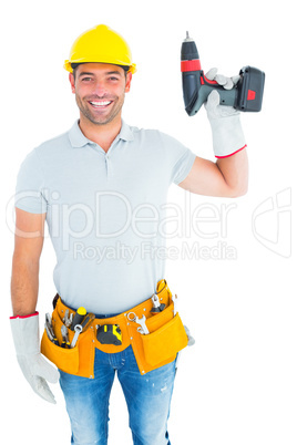 Handyman wearing tool belt while holding power drill