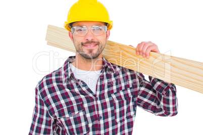 Handyman holding wood planks