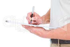Delivery man writing on clipboard