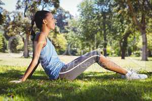 Fit woman sitting in the park