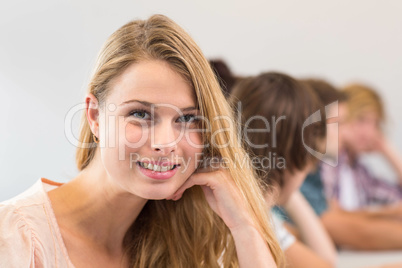 Portrait of smiling female student in classroom