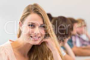 Portrait of smiling female student in classroom