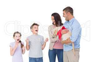 Parents gifting puppy to children