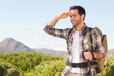 Happy man hiking in the mountains