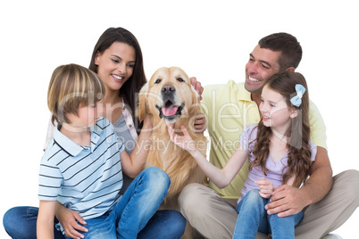 Family stroking dog