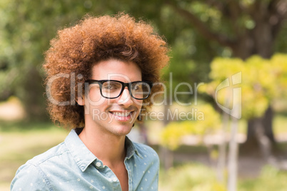 Young hipster smiling at camera