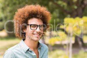 Young hipster smiling at camera