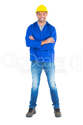 Portrait of happy manual worker standing arms crossed