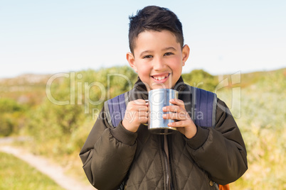 Little boy hiking in the mountains