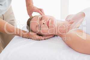 Woman receiving neck massage