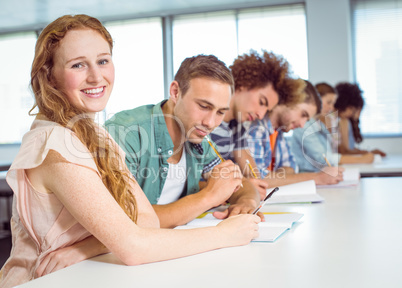 Fashion students taking notes in class