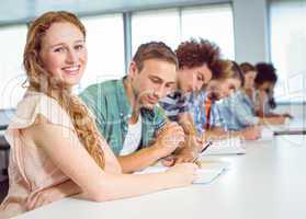 Fashion students taking notes in class