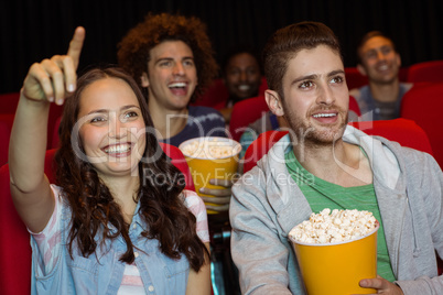 Young couple watching a film