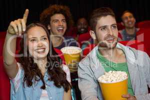 Young couple watching a film