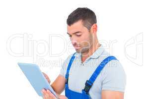 Male carpenter using digital tablet
