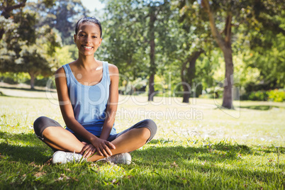 Fit woman sitting in the park