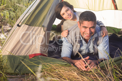 Father and son in their tent