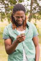 Happy young man using smartphone