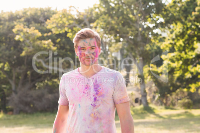 Young man covered in powder paint