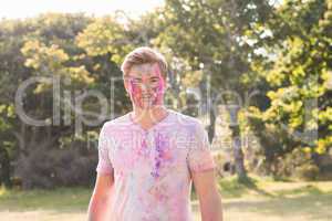 Young man covered in powder paint