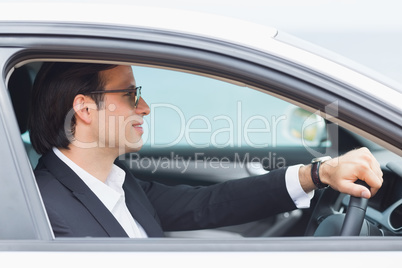 Happy driving businessman