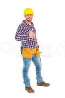 Smiling handyman gesturing thumbs up