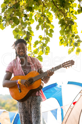 Handsome hipster playing the guitar