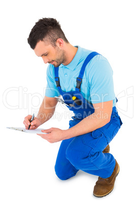 Handyman reading clipboard Handyman reading clipboard
