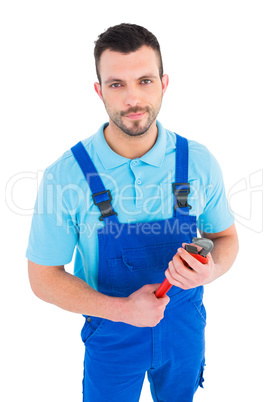 repairman holding adjustable wrench