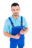 repairman holding adjustable wrench